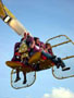 Close up view of passengers on the Speedbuzz booster ride